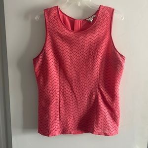 Salmon colored sleeveless top with full back exposed zip